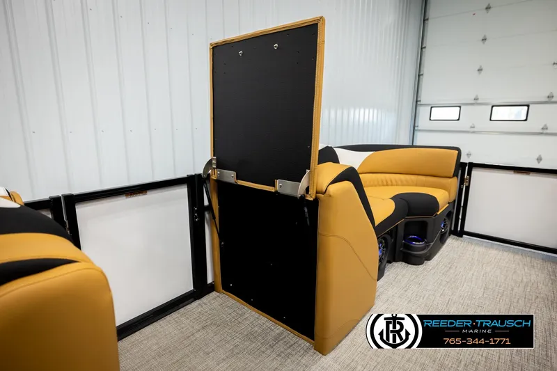 Slide: The Image of 2026 Avalon LSZ VRB interior with tan and black seating in a showroom. - 32