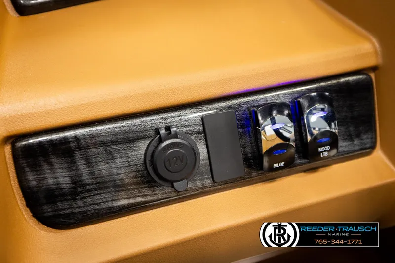 Slide: The Image of Control panel of 2026 Avalon LSZ VRB with 12V outlet and switches. - 36