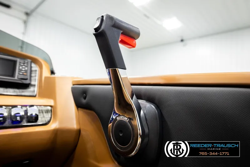 Slide: The Image of Interior of 2026 Avalon LSZ VRB with Suzuki throttle control, Reeder-Trausch Marine branding. - 41
