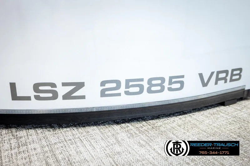 Slide: The Image of 2026 Avalon LSZ VRB boat model with "LSZ 2585 VRB" text, Reeder-Trausch Marine logo. - 51