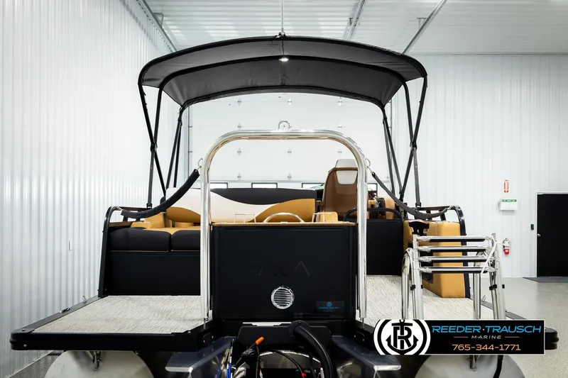 Slide: The Image of 2026 Avalon LSZ VRB pontoon boat in showroom, featuring sleek design and modern amenities. - 7