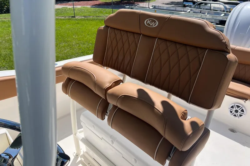 Slide: The Image of 2026 Key West 239 FS boat with tan leather seating and diamond stitching. - 12