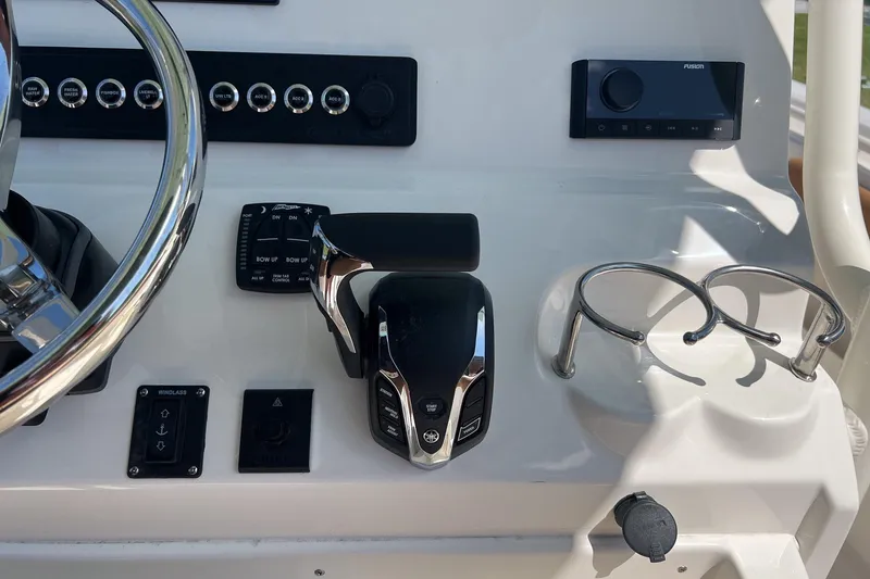 Slide: The Image of Control panel of 2026 Key West 239 FS boat with steering wheel and throttle. - 15