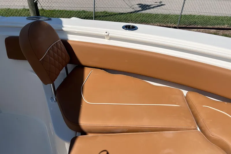 Slide: The Image of 2026 Key West 239 FS boat with tan leather seating and diamond stitching detail. - 21