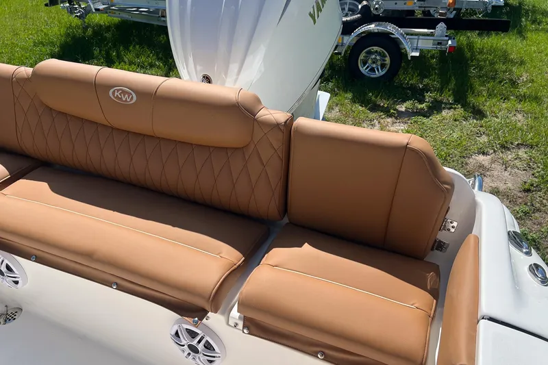 Slide: The Image of 2026 Key West 239 FS boat with tan leather seating and KW logo. - 9
