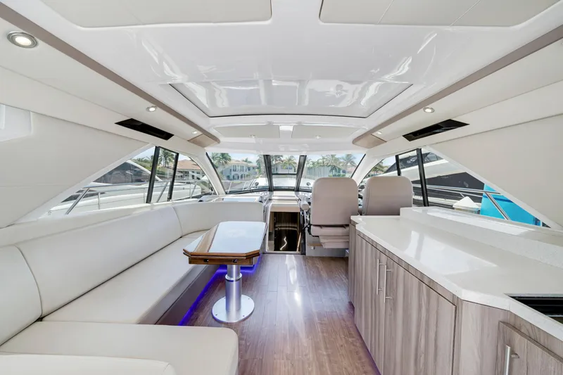 Slide: The Image of Luxurious interior of 2017 Regal 53 Sport Coupe yacht with modern seating and sleek design. - 14