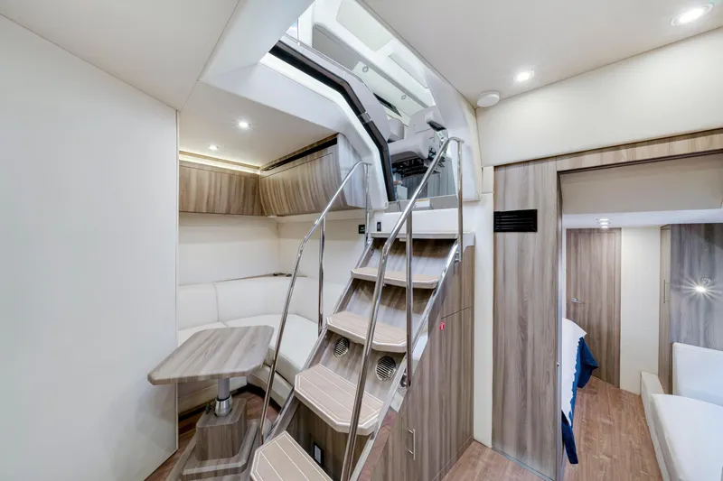 Slide: The Image of Luxurious interior of 2017 Regal 53 Sport Coupe yacht with modern design and elegant furnishings. - 28