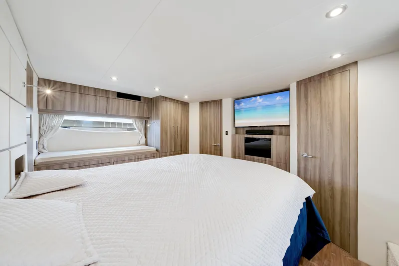 Slide: The Image of Luxurious bedroom interior of 2017 Regal 53 Sport Coupe yacht with modern amenities. - 31