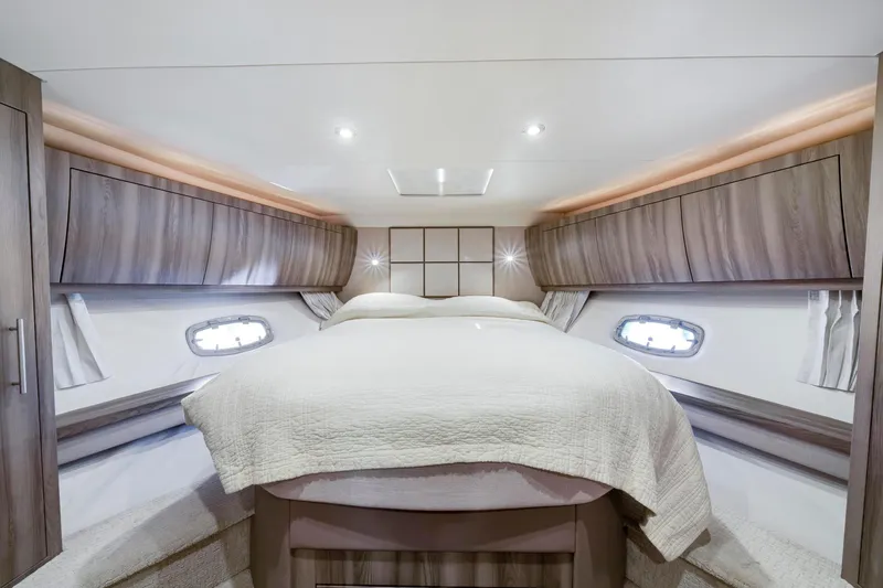 Slide: The Image of Luxurious interior cabin of 2017 Regal 53 Sport Coupe yacht with elegant bedding. - 37