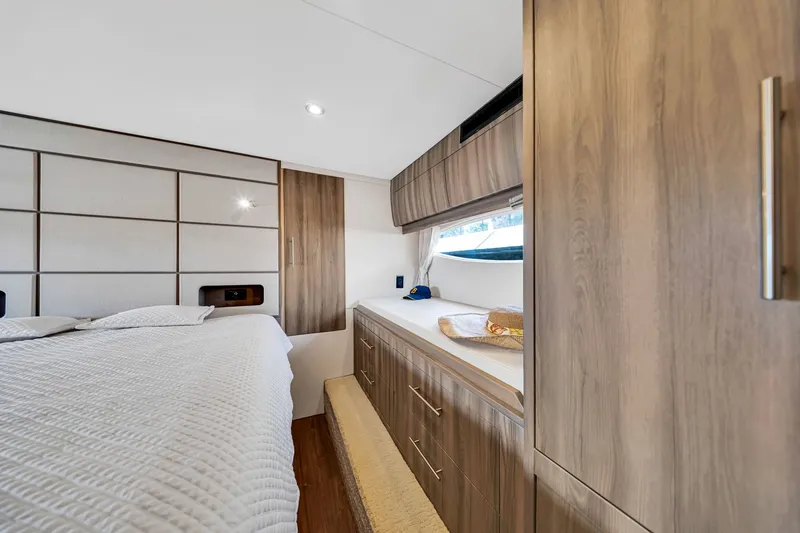 Slide: The Image of Luxurious interior of 2017 Regal 53 Sport Coupe yacht bedroom with modern wood finishes. - 78