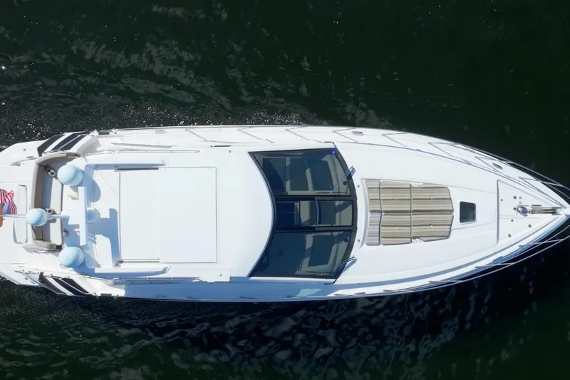 Slide: The Image of Aerial view of 2017 Regal 53 Sport Coupe yacht cruising on water. - 3