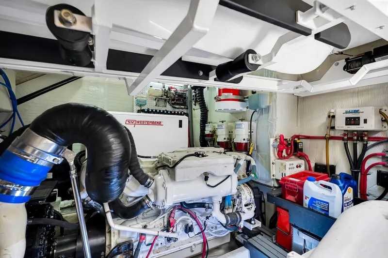 Slide: The Image of Engine room of a 2017 Regal 53 Sport Coupe with visible machinery and equipment. - 84