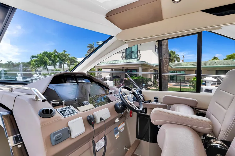 Slide: The Image of Interior view of 2017 Regal 53 Sport Coupe yacht cockpit with modern controls and steering. - 47