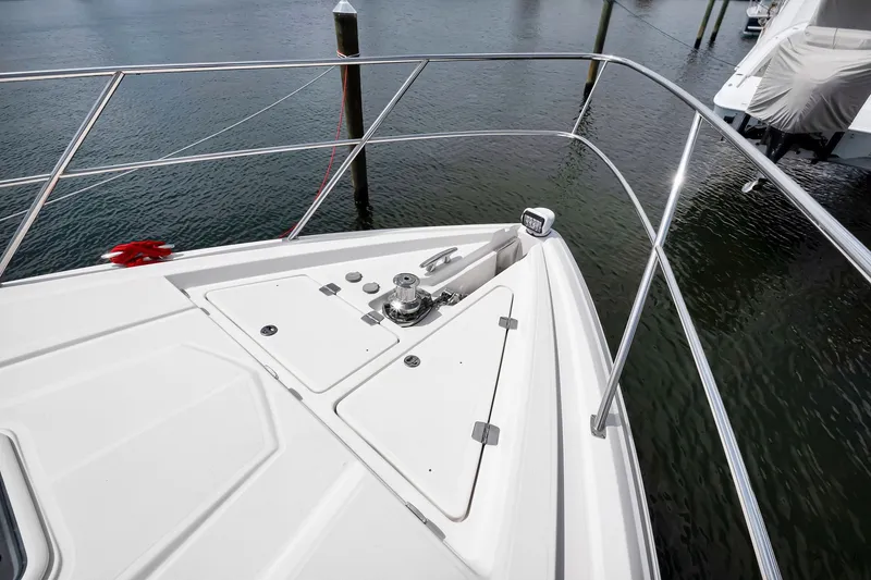 Slide: The Image of Bow of 2017 Regal 53 Sport Coupe yacht with stainless steel railings. - 11
