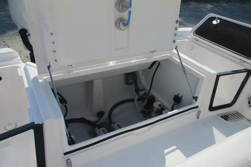 Slide: The Image of Open storage compartment on 2026 Sea Fox 282 Hybrid LT boat, showcasing interior components. - 14