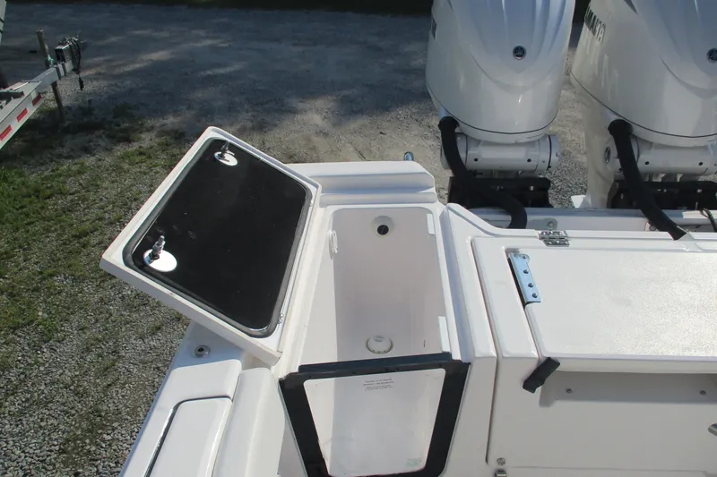 Slide: The Image of Open storage compartment on 2026 Sea Fox 282 Hybrid LT boat with dual engines. - 16