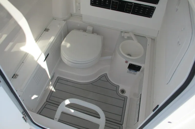 Slide: The Image of 2026 Sea Fox 282 Hybrid LT boat interior with toilet and sink. - 17