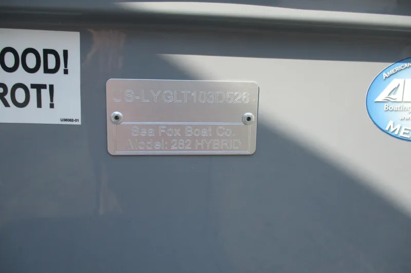 Slide: The Image of 2026 Sea Fox 282 Hybrid LT identification plate on boat hull. - 19