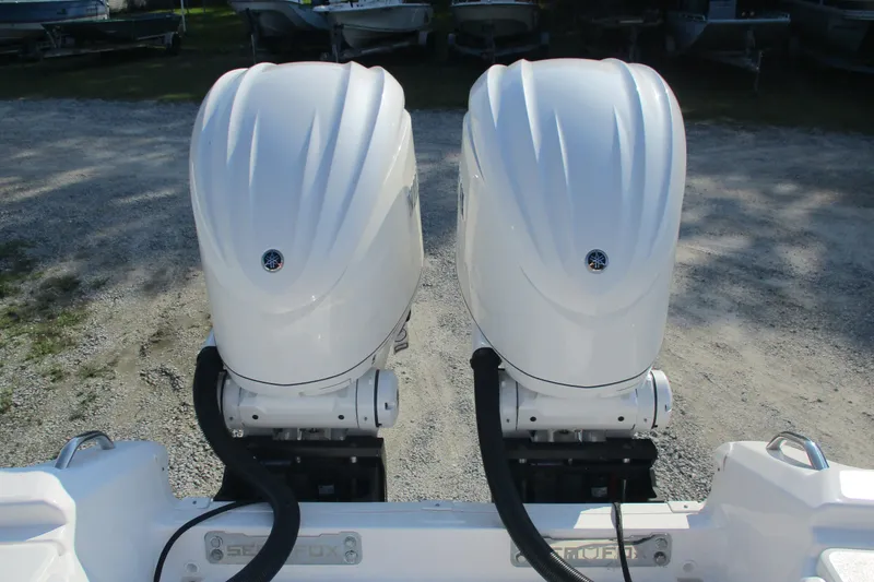 Slide: The Image of Twin outboard engines on a 2026 Sea Fox 282 Hybrid LT boat. - 6