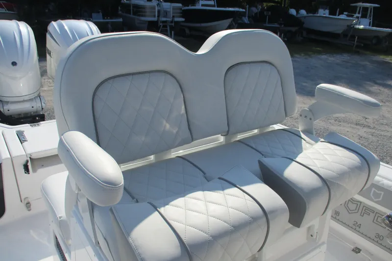 Slide: The Image of 2026 Sea Fox 282 Hybrid LT boat seating with quilted upholstery and armrests. - 8