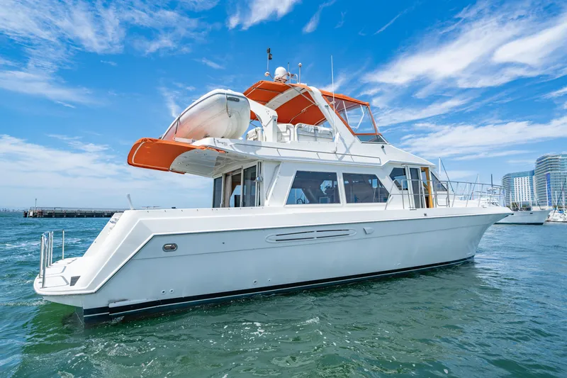 Slide: The Image of Navigator 5300 Classic 2000 yacht on water, clear sky, modern design, luxury boating. - 1