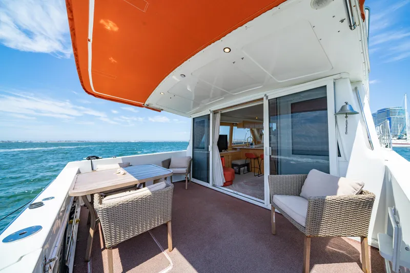 Slide: The Image of Outdoor deck of 2000 Navigator 5300 Classic yacht with seating and ocean view. - 12