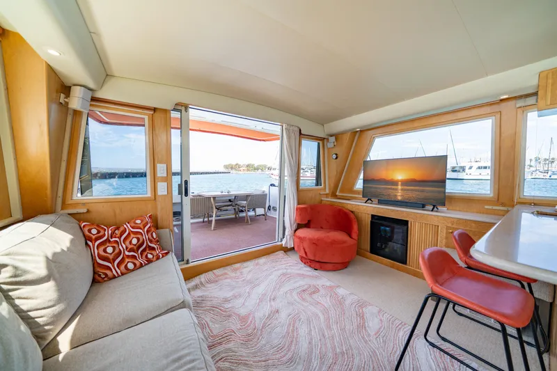 Slide: The Image of Interior of 2000 Navigator 5300 Classic yacht with cozy seating and ocean view. - 13