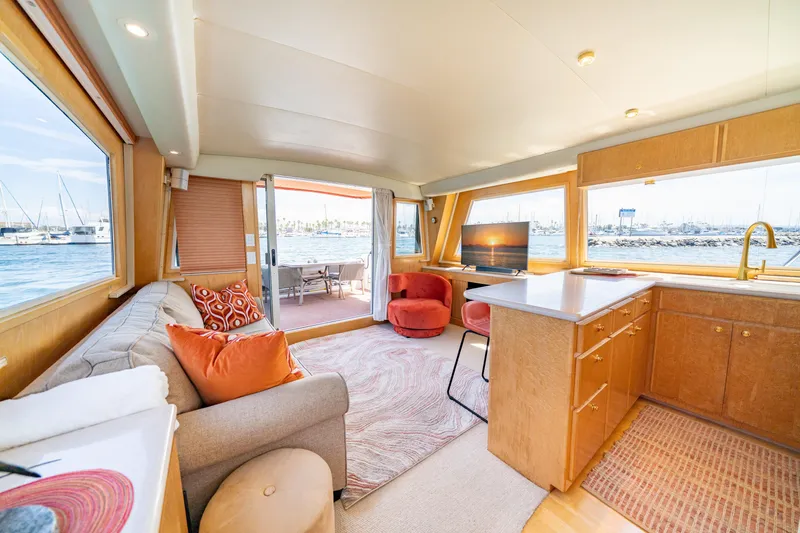 Slide: The Image of Luxurious interior of 2000 Navigator 5300 Classic yacht with modern furnishings and scenic views. - 14