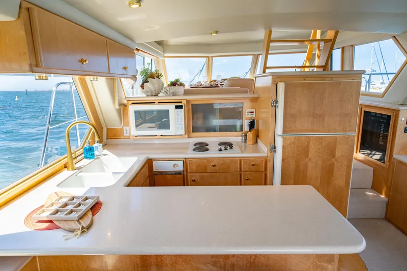 Slide: The Image of Luxurious kitchen interior of 2000 Navigator 5300 Classic yacht with ocean view. - 16