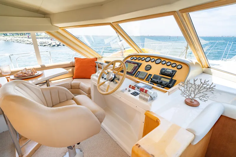 Slide: The Image of Luxurious 2000 Navigator 5300 Classic yacht helm with plush seating and ocean view. - 20