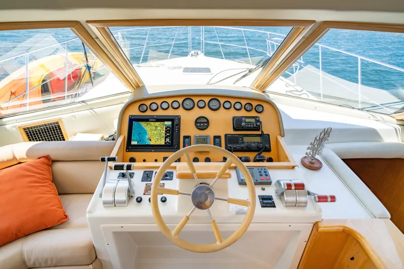 Slide: The Image of Cockpit of 2000 Navigator 5300 Classic yacht with steering wheel and navigation instruments. - 21