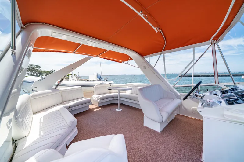 Slide: The Image of Luxurious 2000 Navigator 5300 Classic yacht interior with orange canopy and white seating. - 27