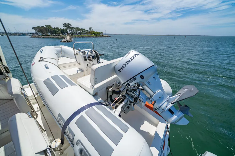 Slide: The Image of Inflatable boat with Honda motor on Navigator 5300 Classic, 2000 model, near scenic coastline. - 29