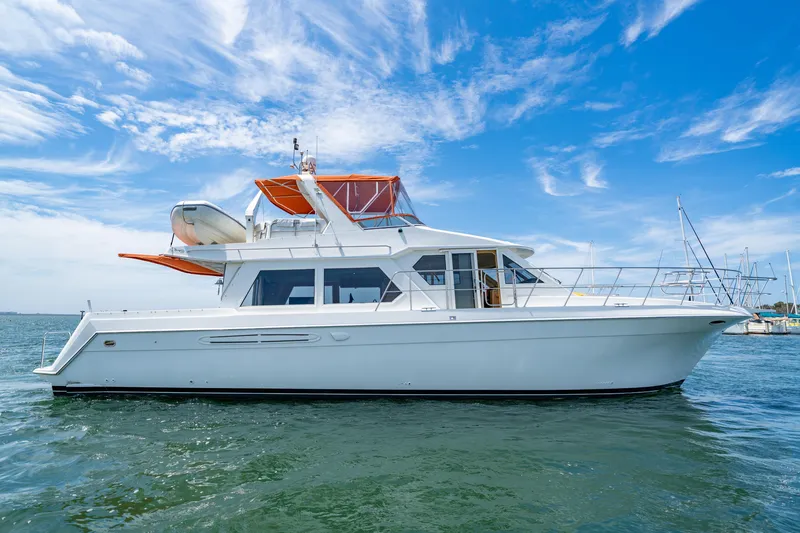Slide: The Image of 2000 Navigator 5300 Classic yacht on water under blue sky. - 3