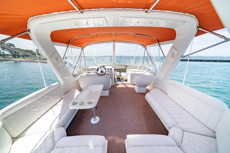 Slide: The Image of Luxurious 2000 Navigator 5300 Classic yacht interior with orange canopy and white seating. - 30