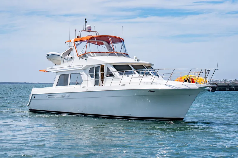 Slide: The Image of Navigator 5300 Classic yacht from 2000 cruising on open water. - 4