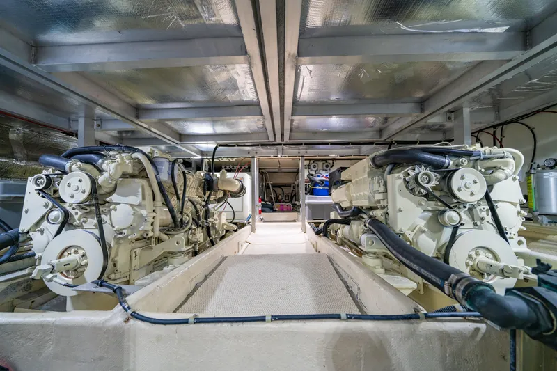 Slide: The Image of Engine room of a 2000 Navigator 5300 Classic yacht, showcasing dual engines. - 44