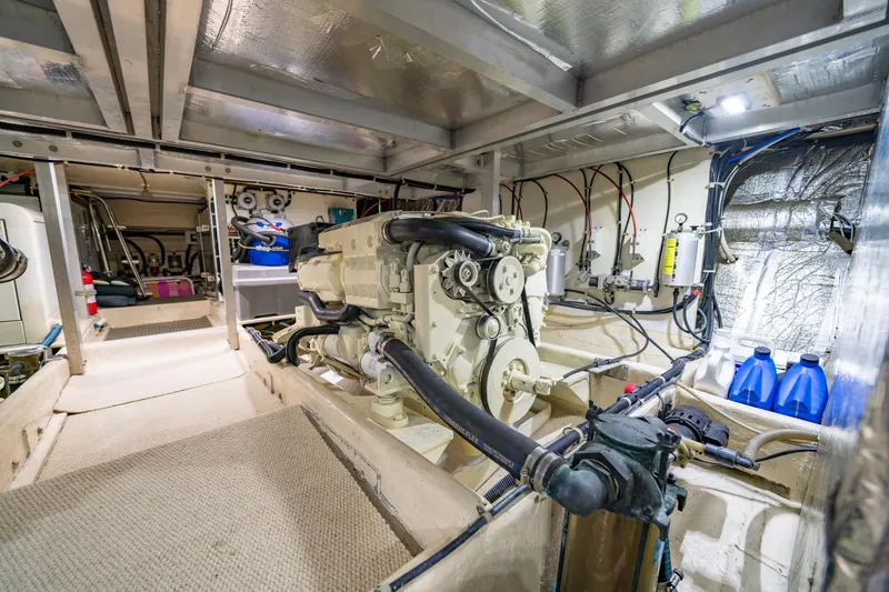 Slide: The Image of Engine room of 2000 Navigator 5300 Classic yacht, showcasing machinery and equipment. - 47