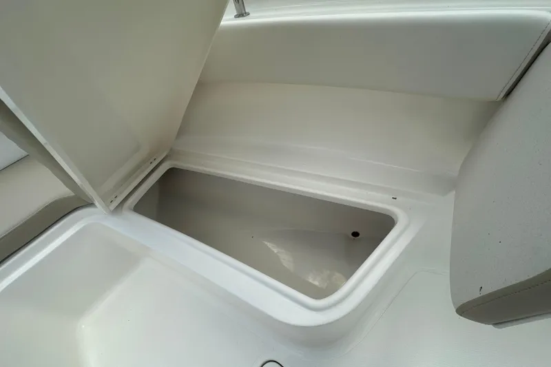 Slide: The Image of Open storage compartment on 2026 Bulls Bay 255 CC boat. - 10