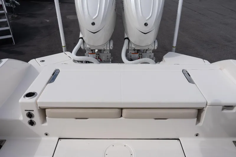 Slide: The Image of 2026 Solace 28 HCS boat with dual outboard engines, rear deck view. - 21