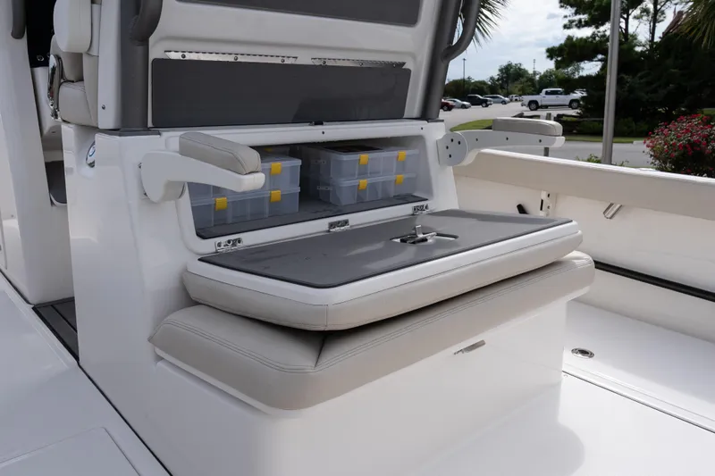 Slide: The Image of 2026 Solace 28 HCS boat interior with storage compartments and seating. - 25