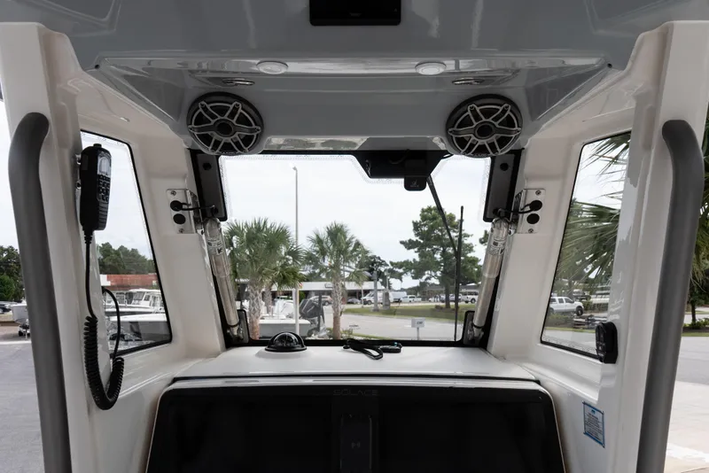 Slide: The Image of Interior view of 2026 Solace 28 HCS boat with speakers and communication equipment. - 28