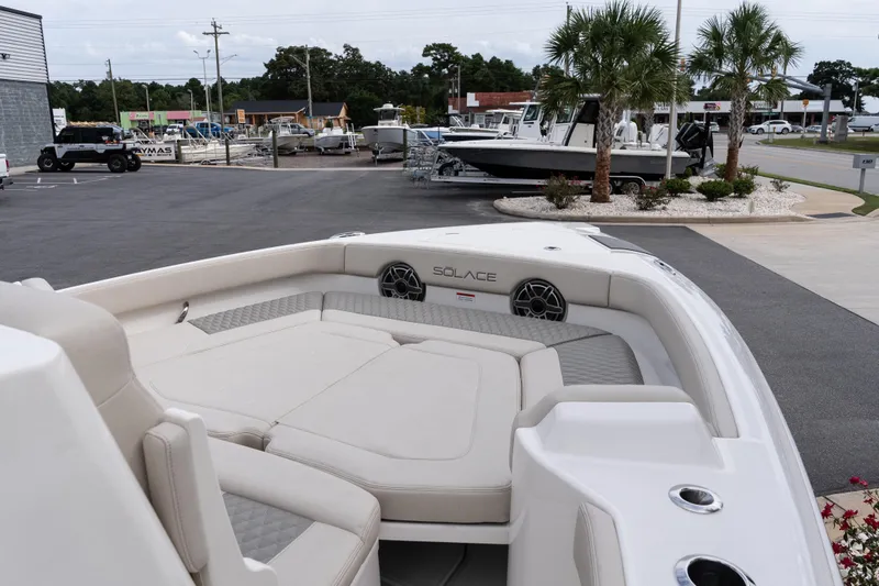 Slide: The Image of 2026 Solace 28 HCS boat interior with cushioned seating and modern design. - 34