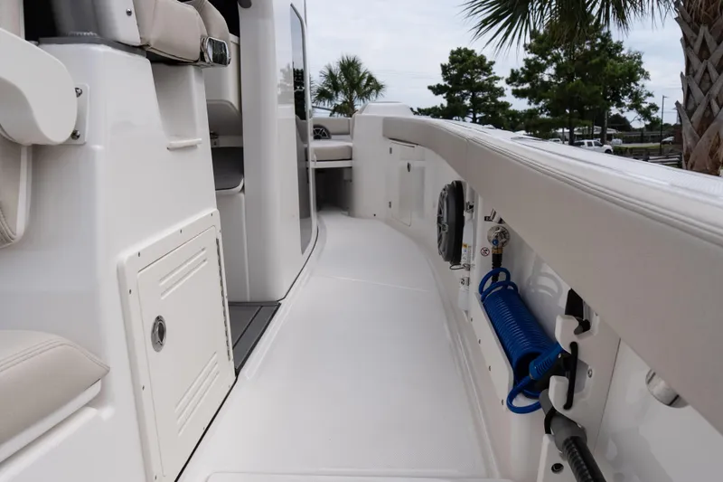 Slide: The Image of 2026 Solace 28 HCS boat interior with seating and storage compartments. - 37