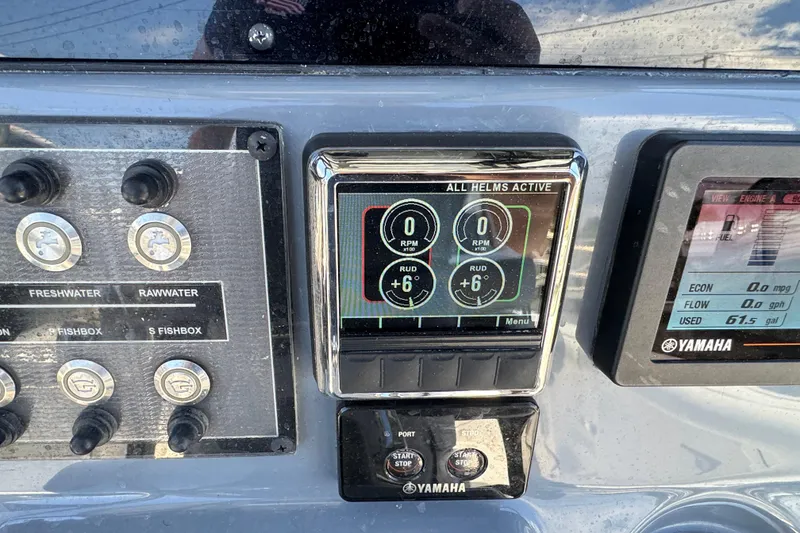 Slide: The Image of Control panel of a 2021 Tidewater 272 CC Adventure boat with Yamaha displays. - 14