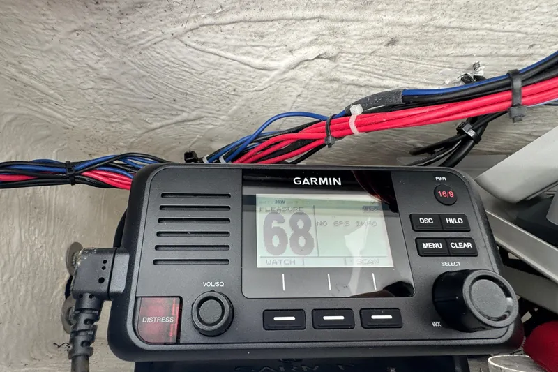 Slide: The Image of Garmin marine radio on 2021 Tidewater 272 CC Adventure boat, displaying channel 68. - 15