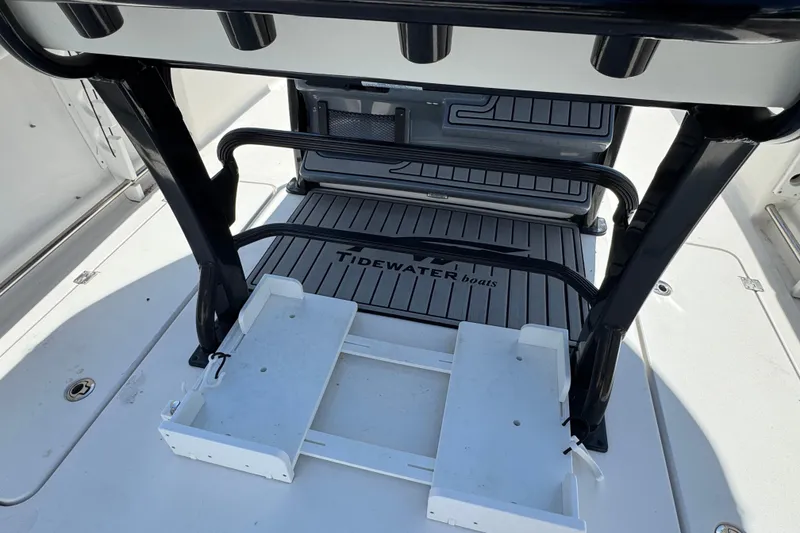 Slide: The Image of 2021 Tidewater 272 CC Adventure boat deck with rod holders and storage. - 7