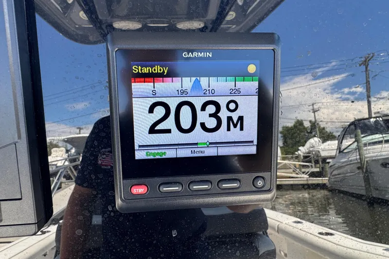 Slide: The Image of Garmin display on 2021 Tidewater 272 CC Adventure boat showing 203° heading. - 9