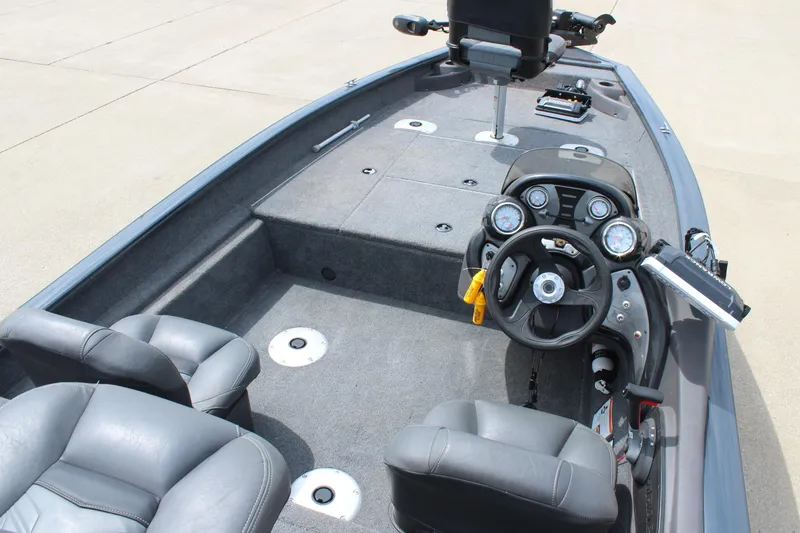 Slide: The Image of 2020 Tracker Pro Team 175 TF boat interior with steering console and seating. - 13