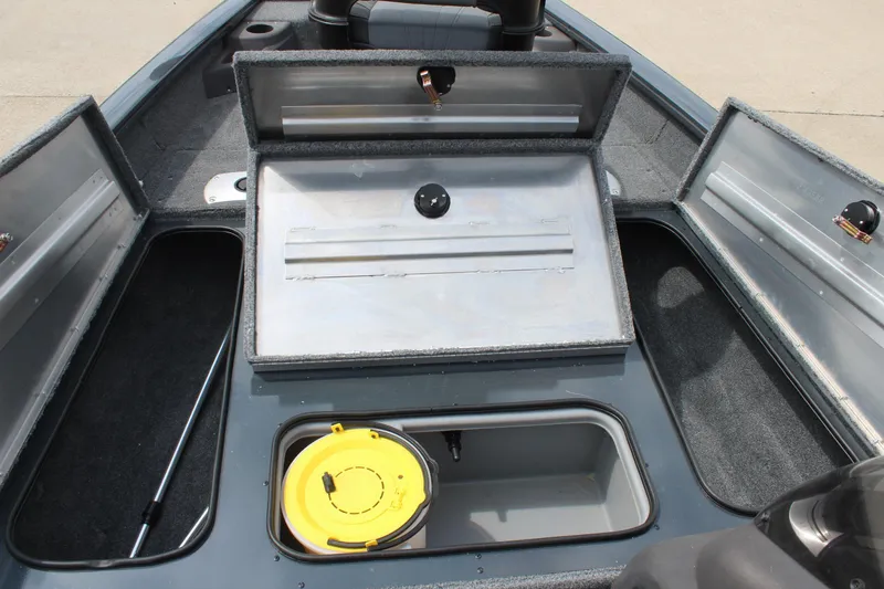 Slide: The Image of 2020 Tracker Pro Team 175 TF boat storage compartments with open lids and yellow container. - 14